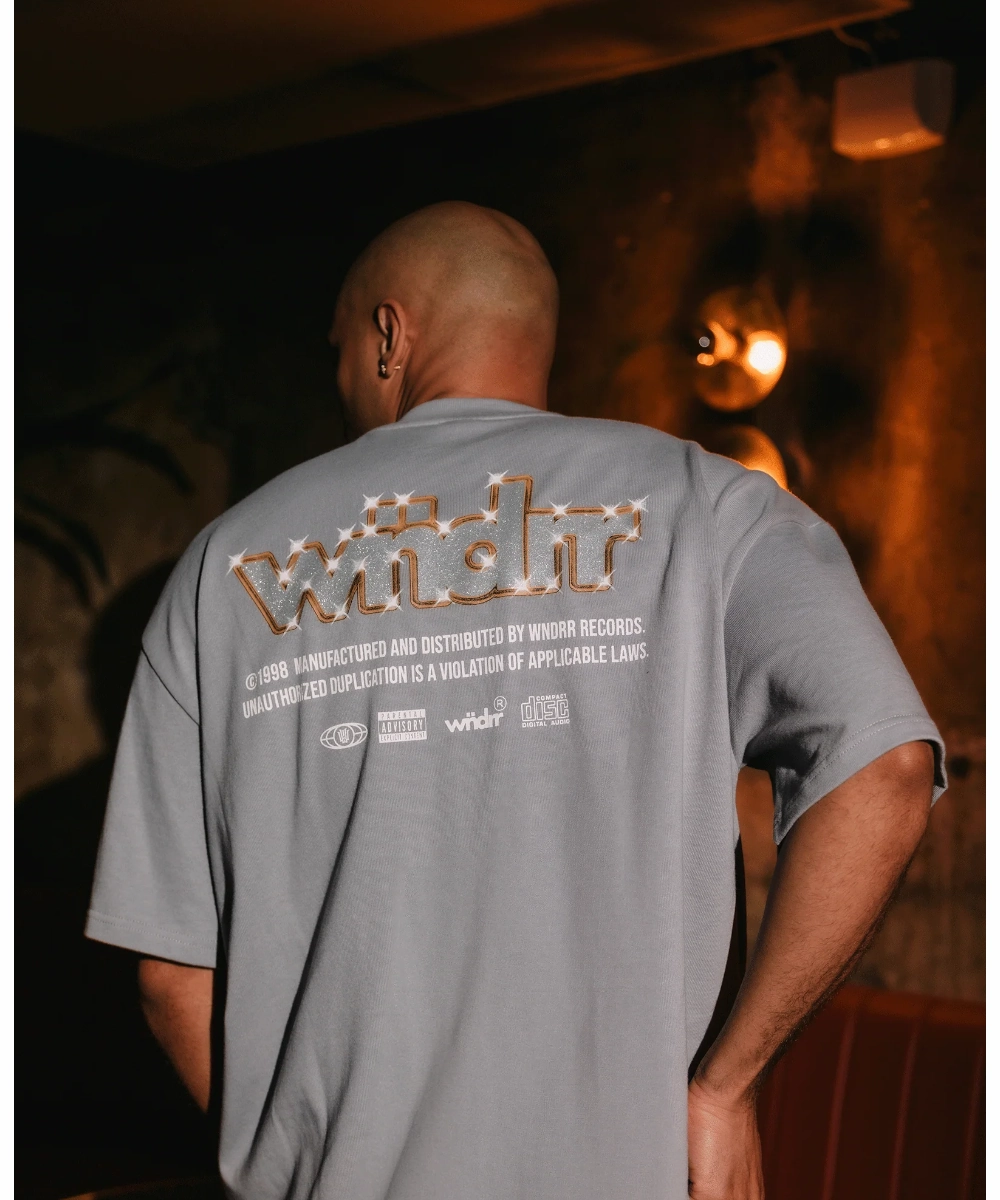 Sequin Glow QuickRelease Fasteners WNDRR Violation Heave Weight Tee (Cement Grey)