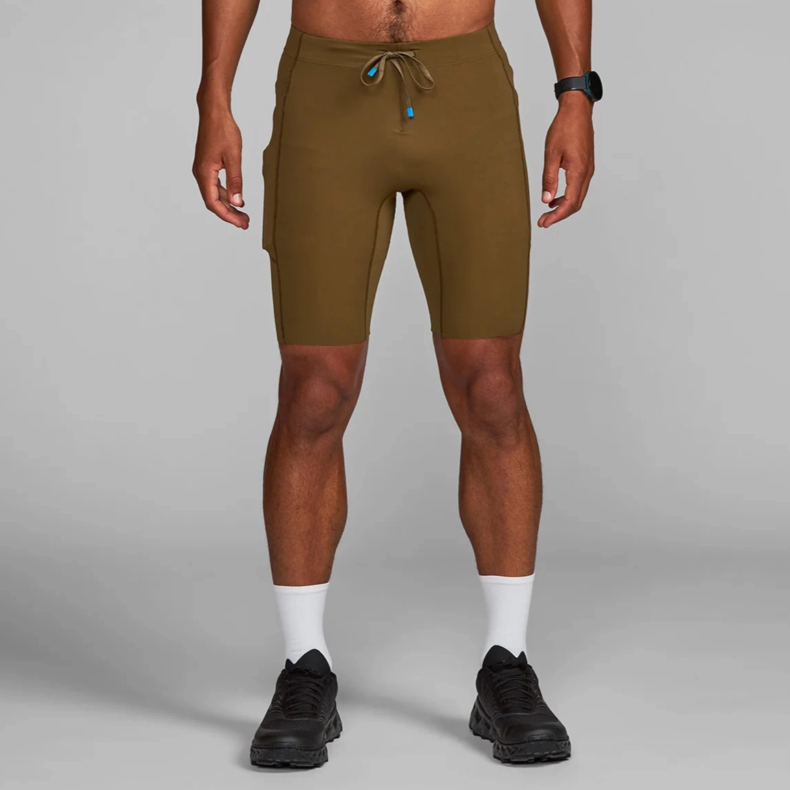 Janji Men's 8" Trail Half Tight Tapered leg warm tones