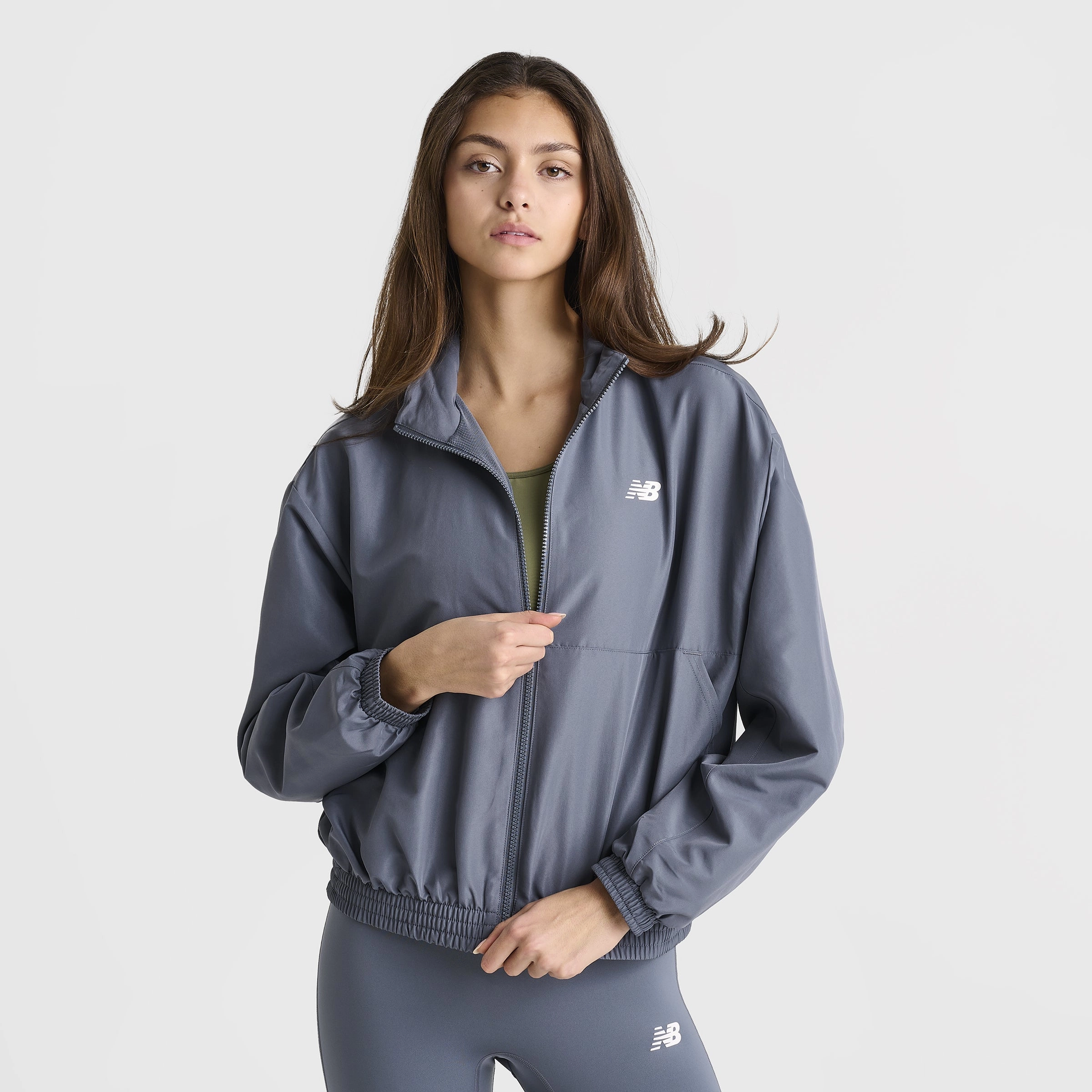 New Balance Women's Linear Woven Jacket / Dark Arctic ShrinkResistantFabric Shrink Resistant Treatment