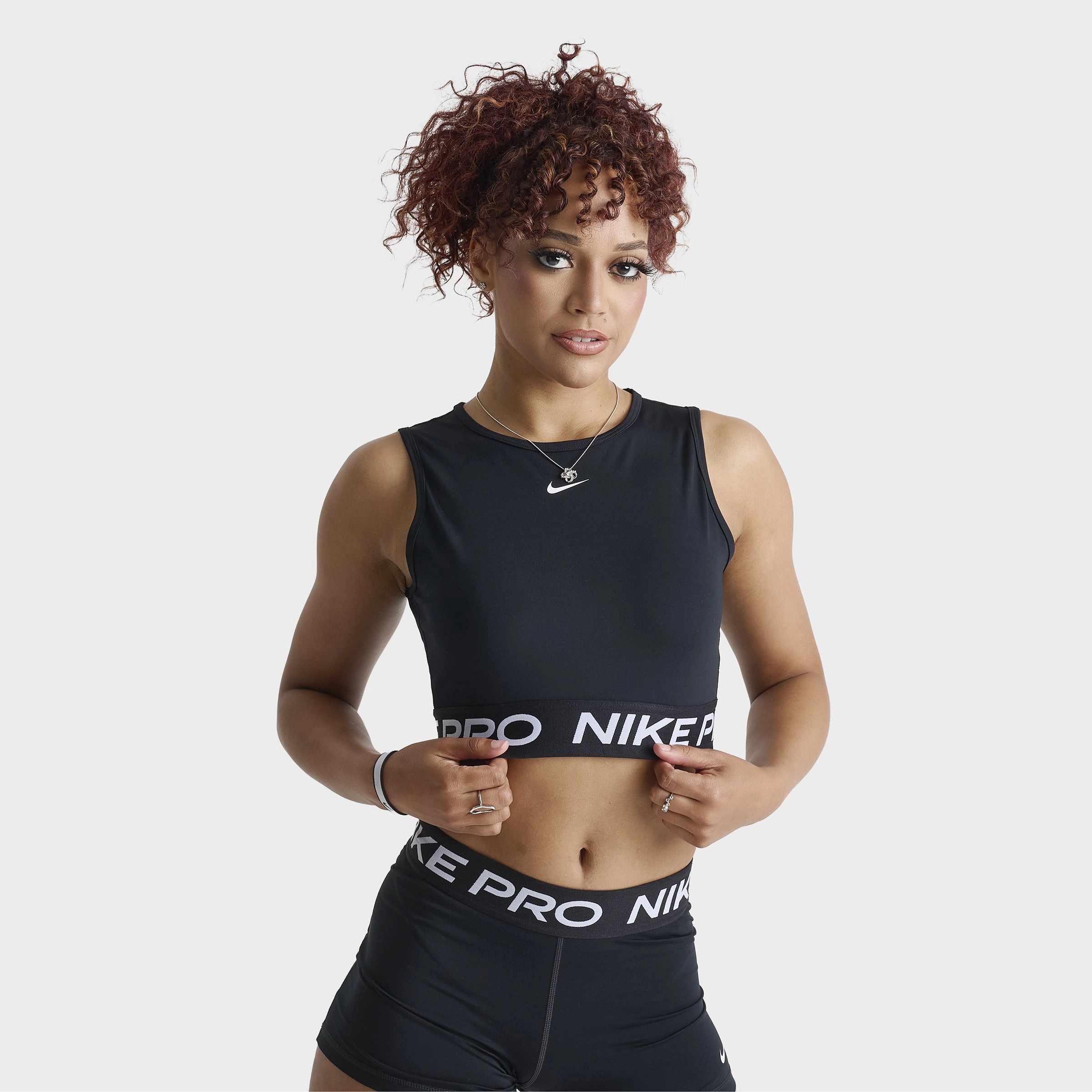 Feather Glow Leader Fit Nike Pro Women's Dri-FIT Cropped Tank Top Black / White
