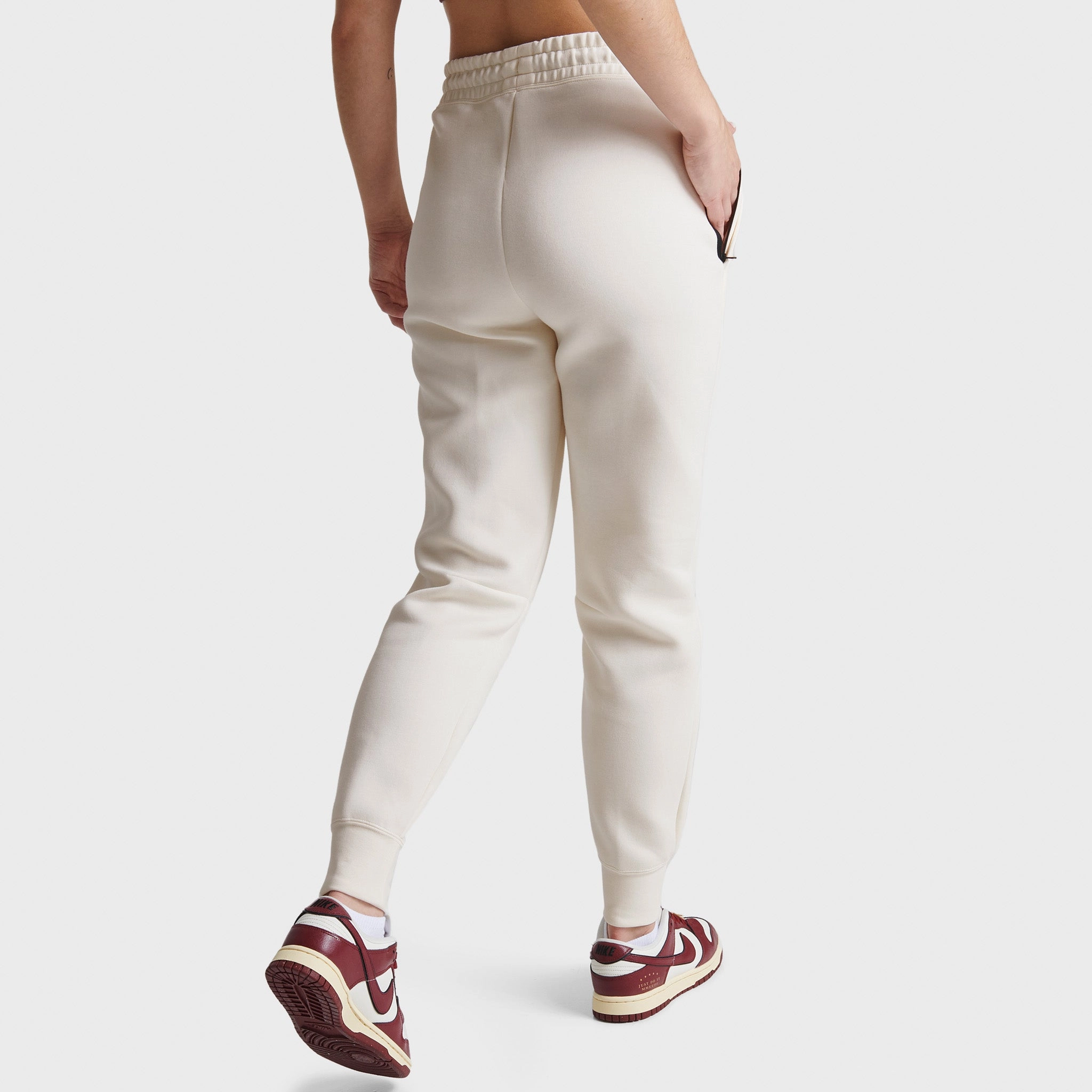 Nike Sportswear Women's Tech Fleece Mid-Rise Joggers Pale Ivory / Black Nature Glow NonRestrictiveSilhouette