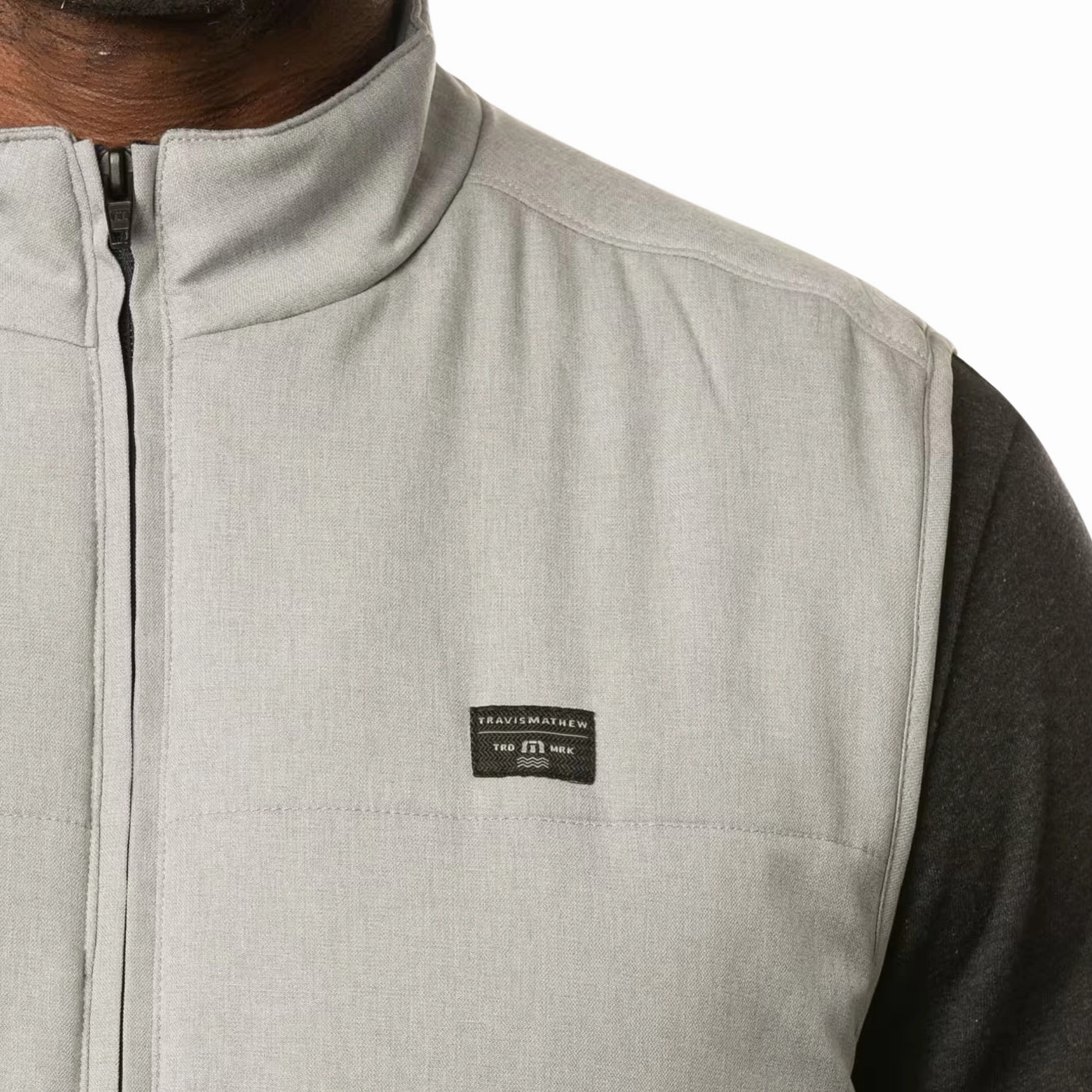 Travis Mathew Interlude Puffer Golf Vest - Heather Sleet Laser Cut Details