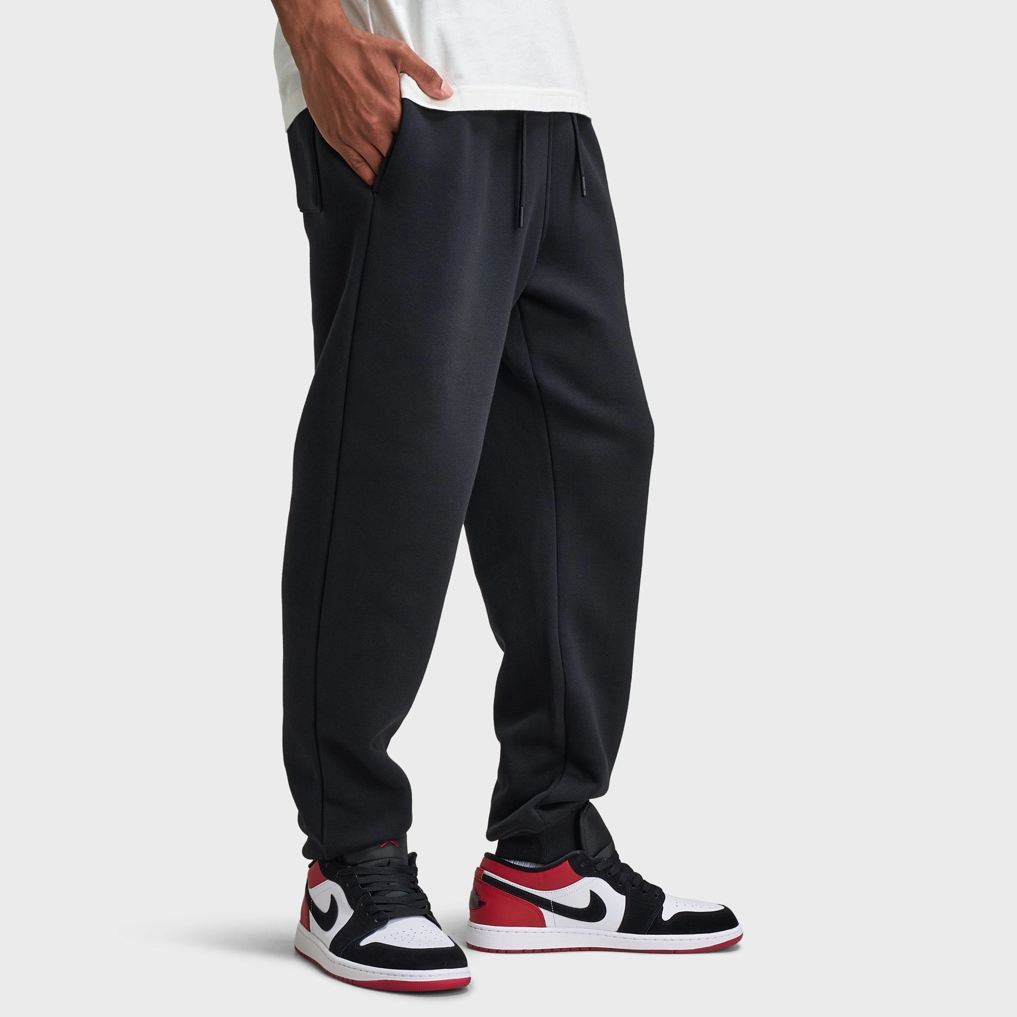 OdorResistant Fabric LowFriction Zipper Guards Jordan Brooklyn Varsity Fleece Joggers Black / White