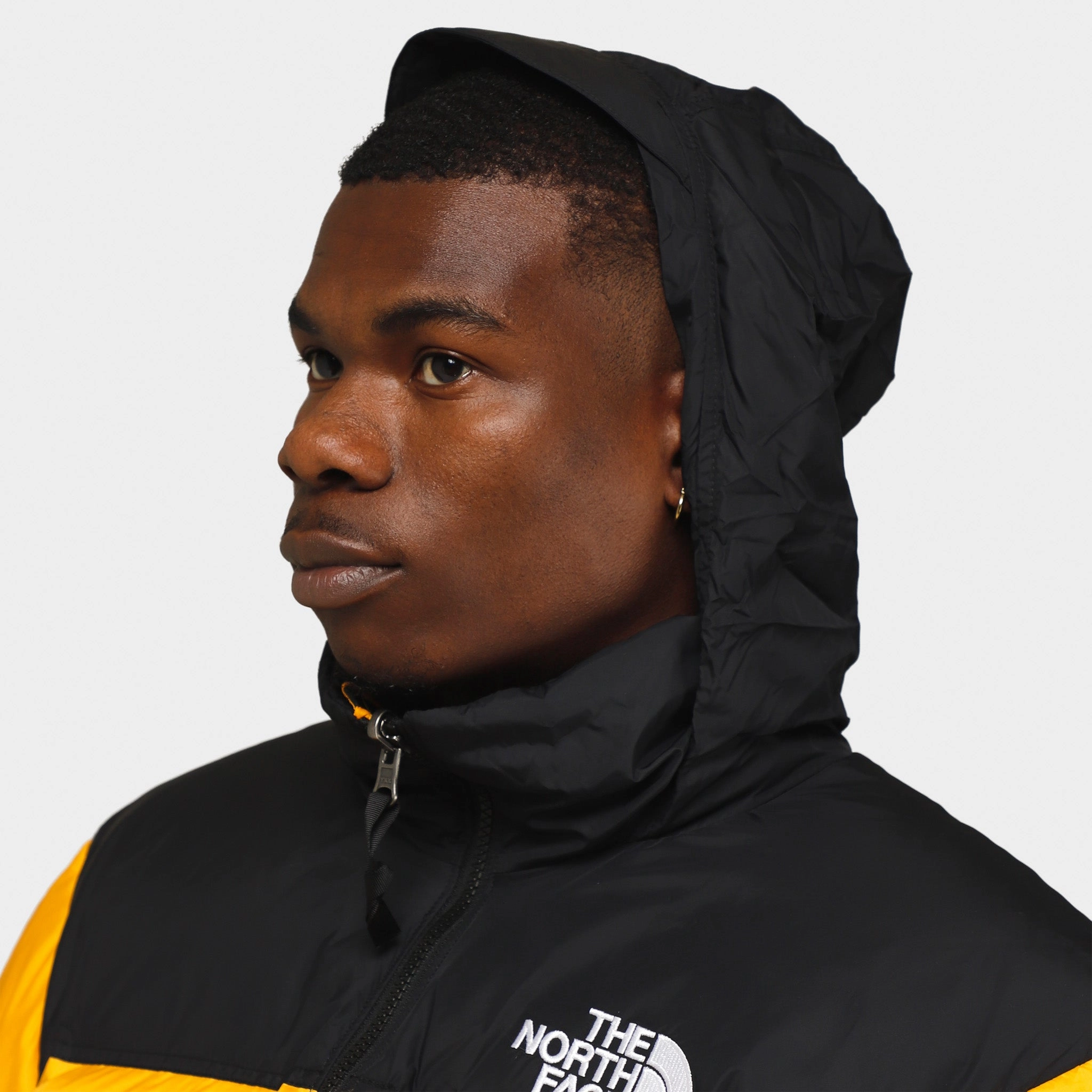 Gym outfit The North Face 1996 Retro Nuptse Jacket Summit Gold / TNF Black