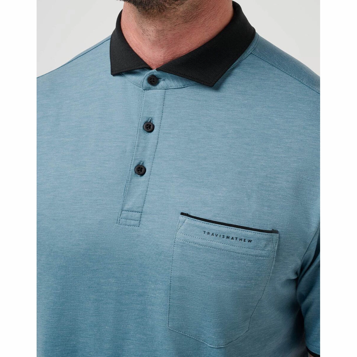 Travis Mathew Featherweight Pocket Golf Polo Shirt  - Captains Blue Clubhouse Attire Curved Hemline