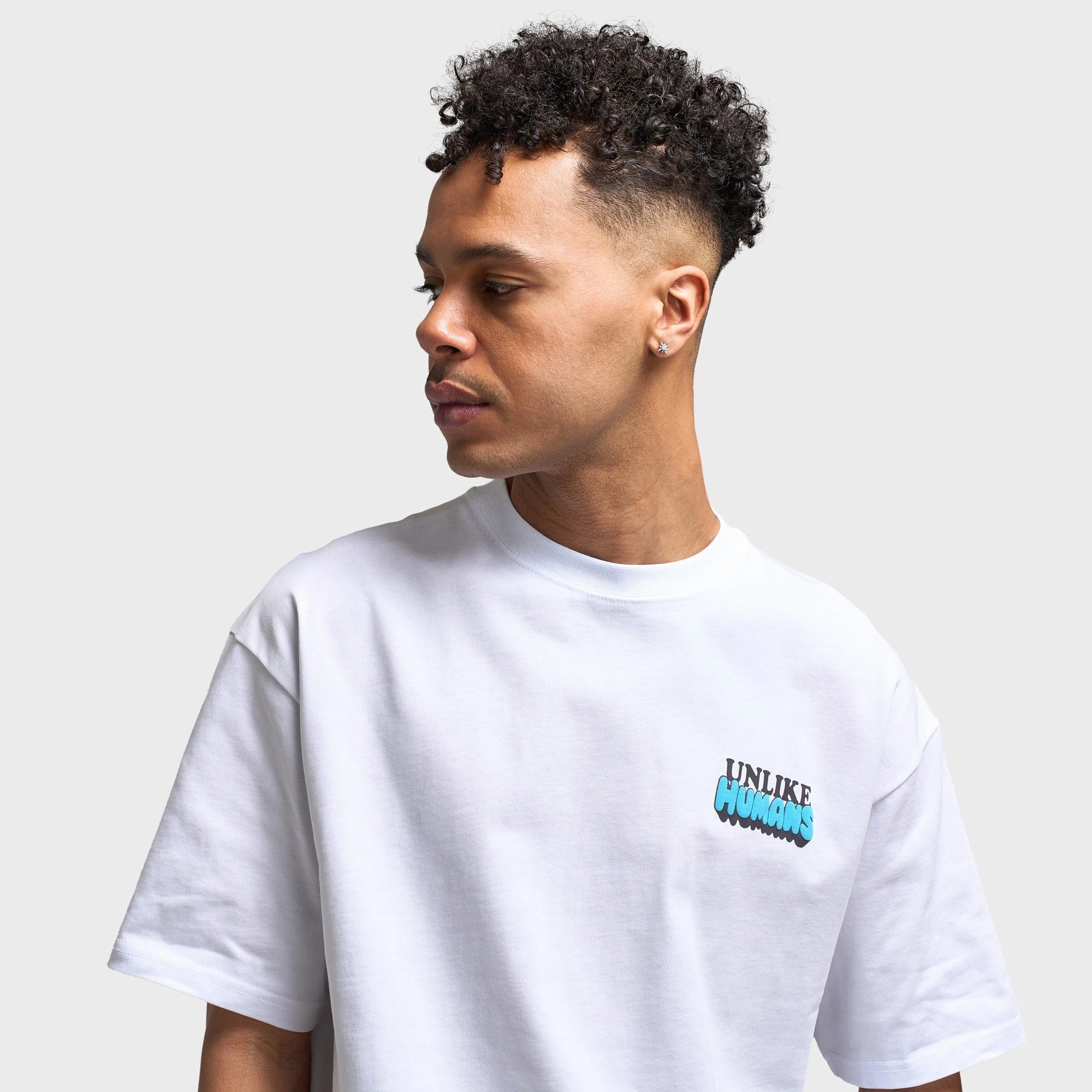Unlike Humans Design Dept Graphic T-Shirt / Optic White Tension Relief Seams Flexible Mobility Design