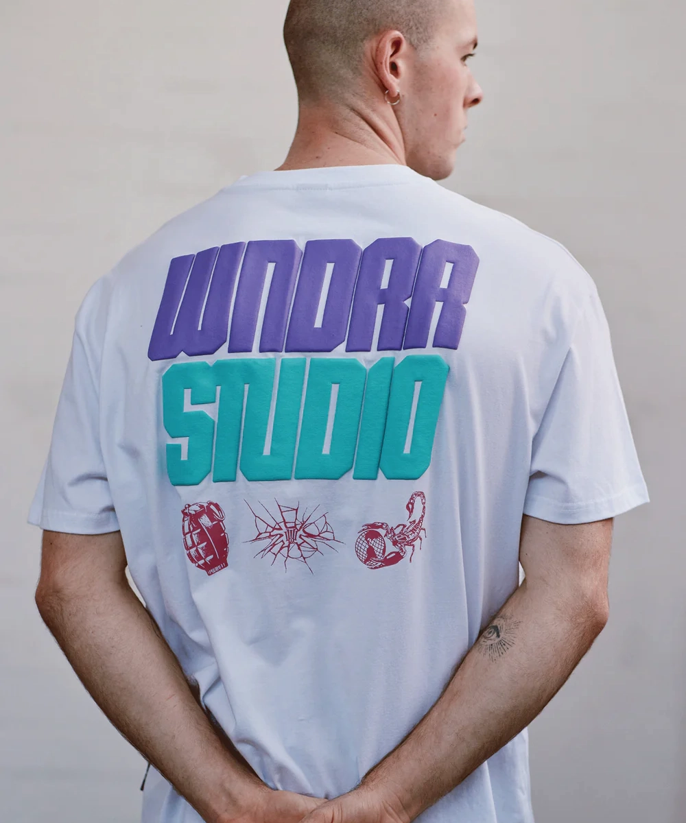 Wind Glow Sustainable Base WNDRR Opponent Box Fit Tee (White)